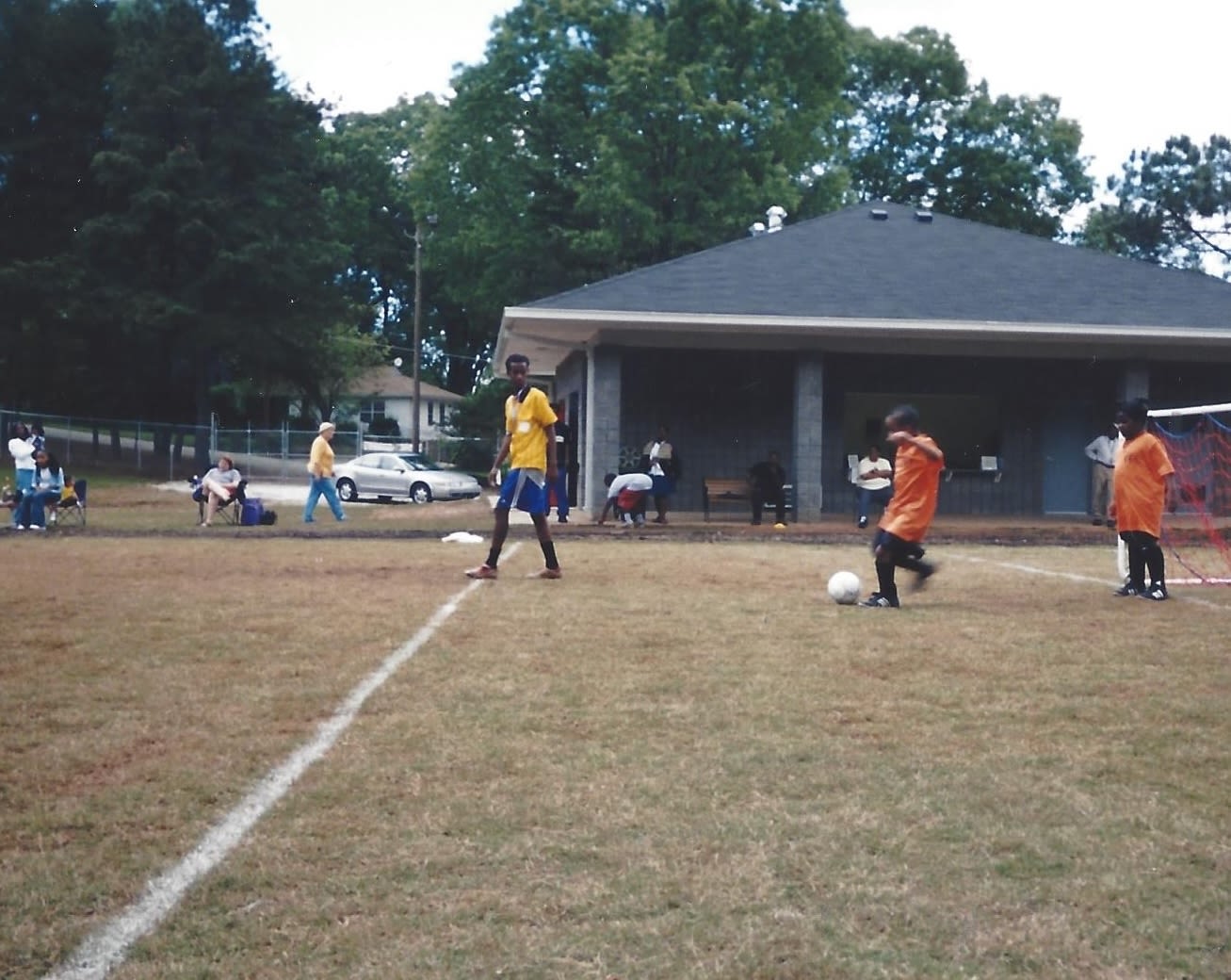 Children playing soccer on public outdoor field